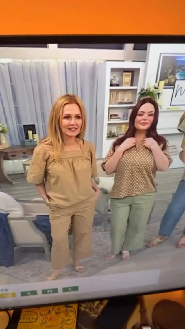 Jennie Garth models a beige two-piece outfit while a second woman models a patterned top and light green pants.