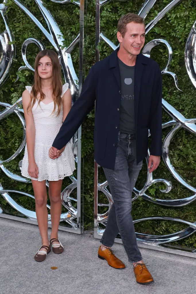 Briar Rose Christensen and Hayden Christensen hold hands at the Lucas Museum of Narrative Art Opening Night.