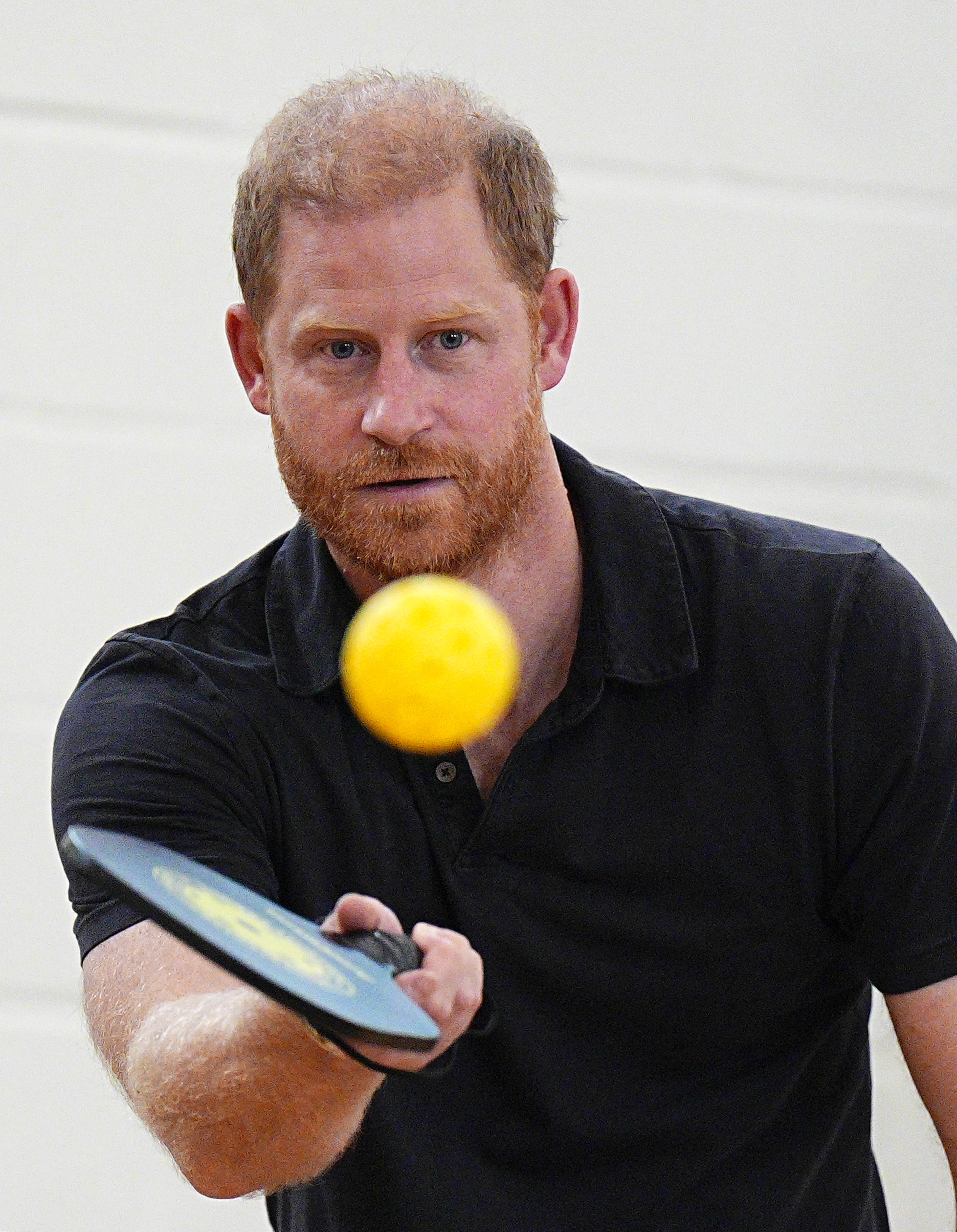 Prince Harry playing pickleball.