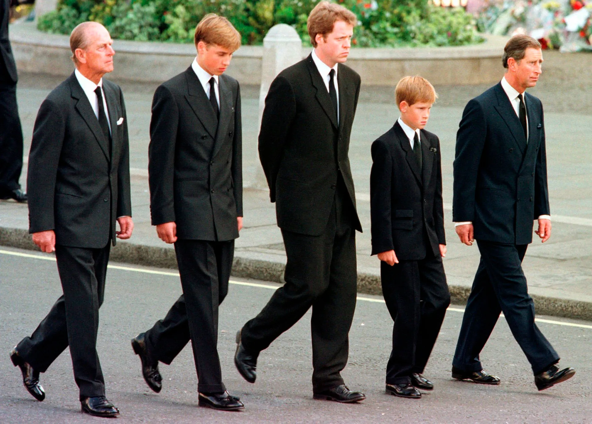 Prince Philip, Prince William, Earl Spencer, Prince Harry, and Prince Charles walk in a funeral procession.
