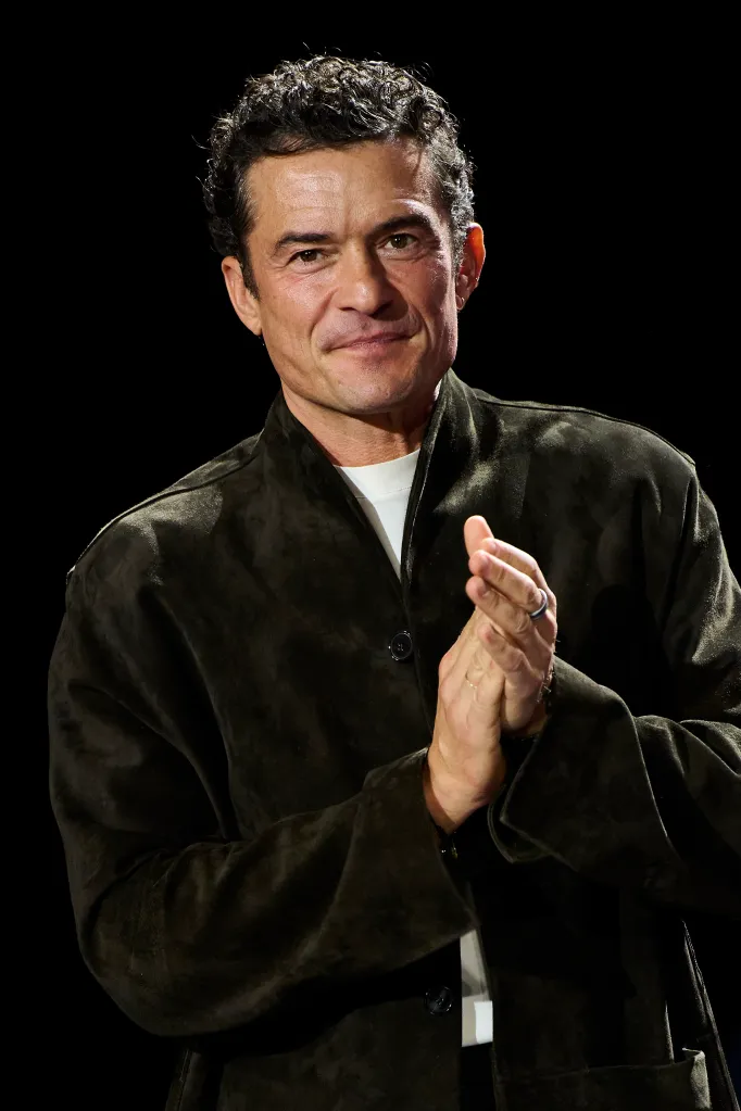 Orlando Bloom applauding.