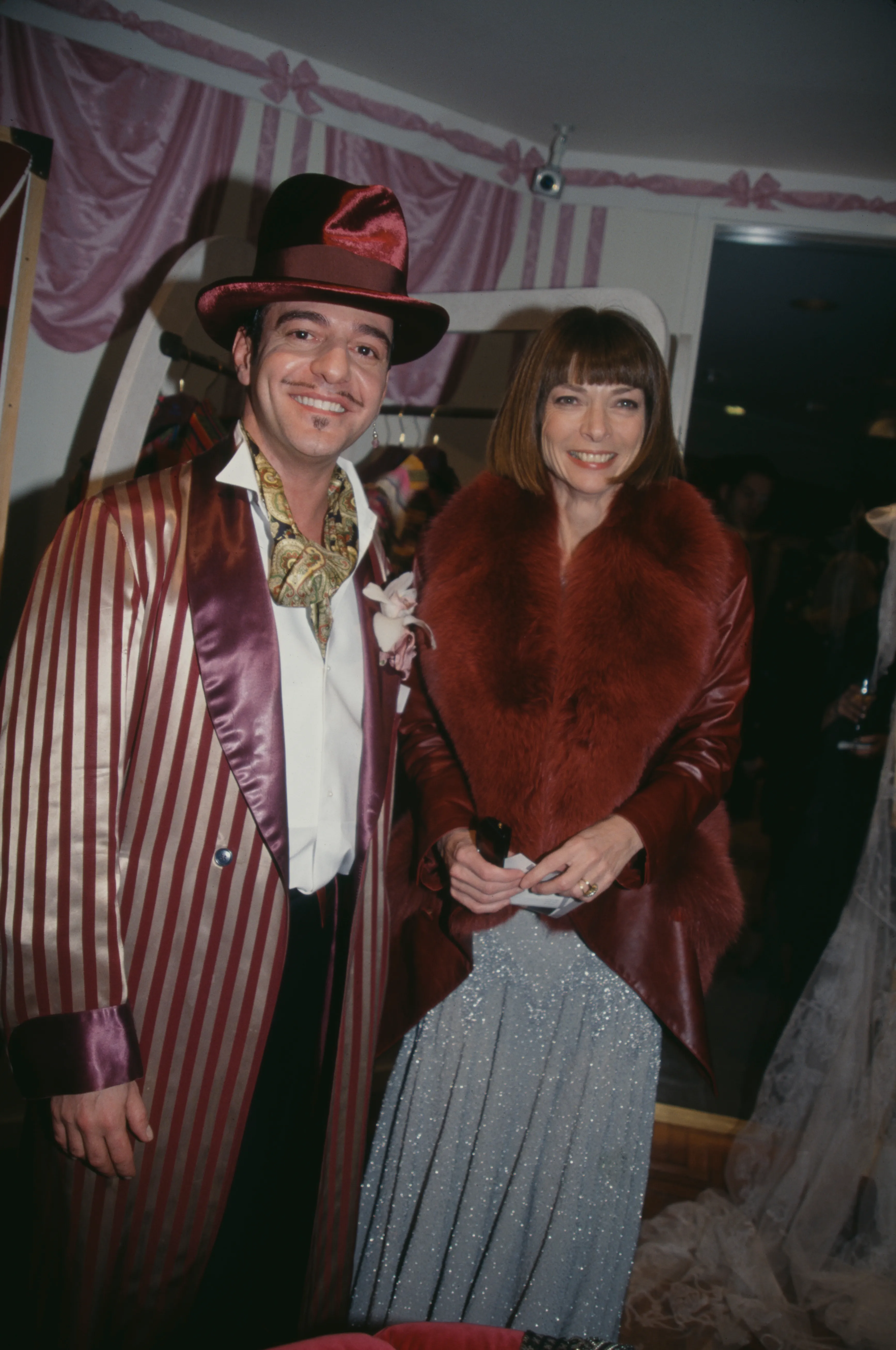John Galliano and Anna Wintour at a party.