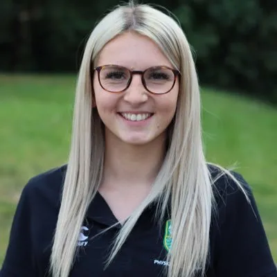 Bronwen James, a PE teacher, smiling at the camera.