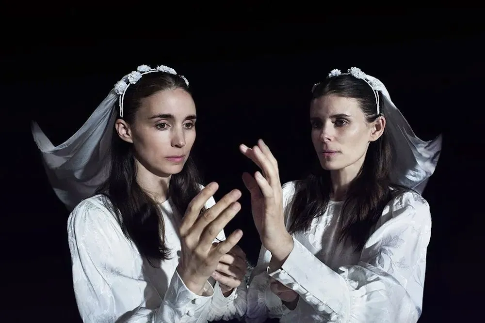 Kate and Rooney Mara dressed in white veils.