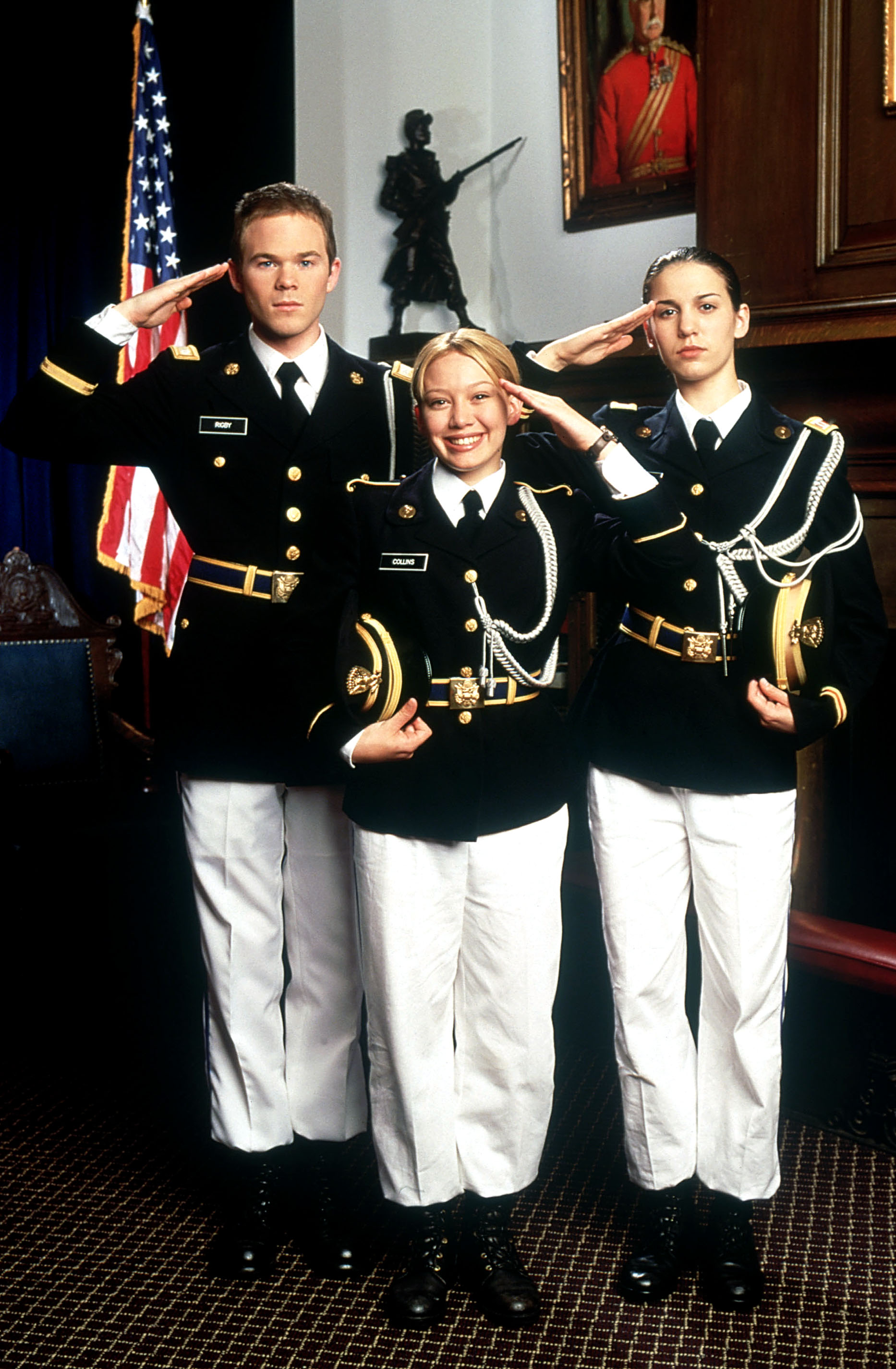 Shawn Ashmore, Hilary Duff, and Christy Carlson Romano in uniform, saluting in Cadet Kelly.
