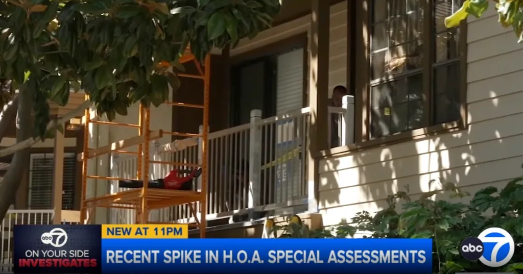A condominium building with a person visible on a balcony, scaffolding, and news channel ABC7 text 