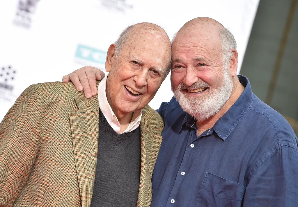 Carl Reiner and Rob Reiner smiling at a Hand and Footprint Ceremony.