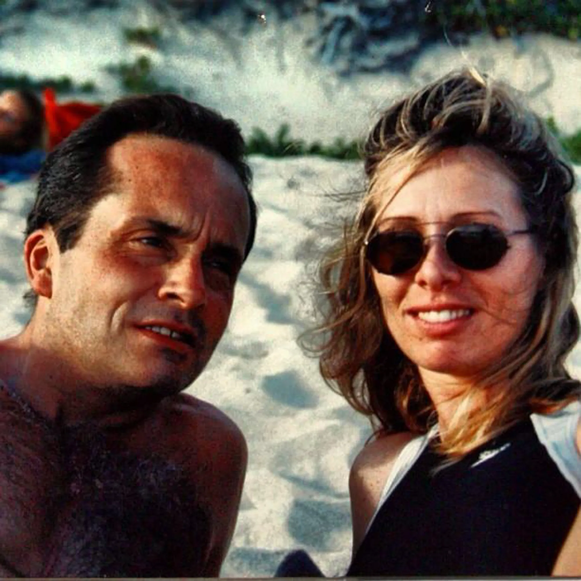 Carole Radziwill and her husband Anthony on a beach.