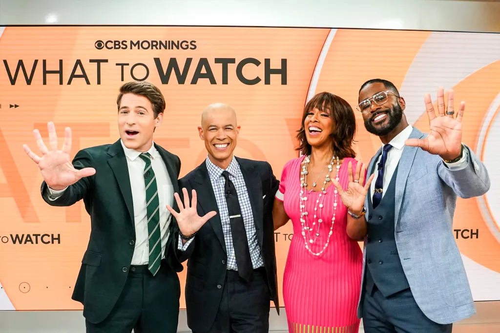 Tony Dokoupil, Vladimir Duthiers, Gayle King, and Nate Burleson posing and holding up five fingers to celebrate their five-year anniversaries on 