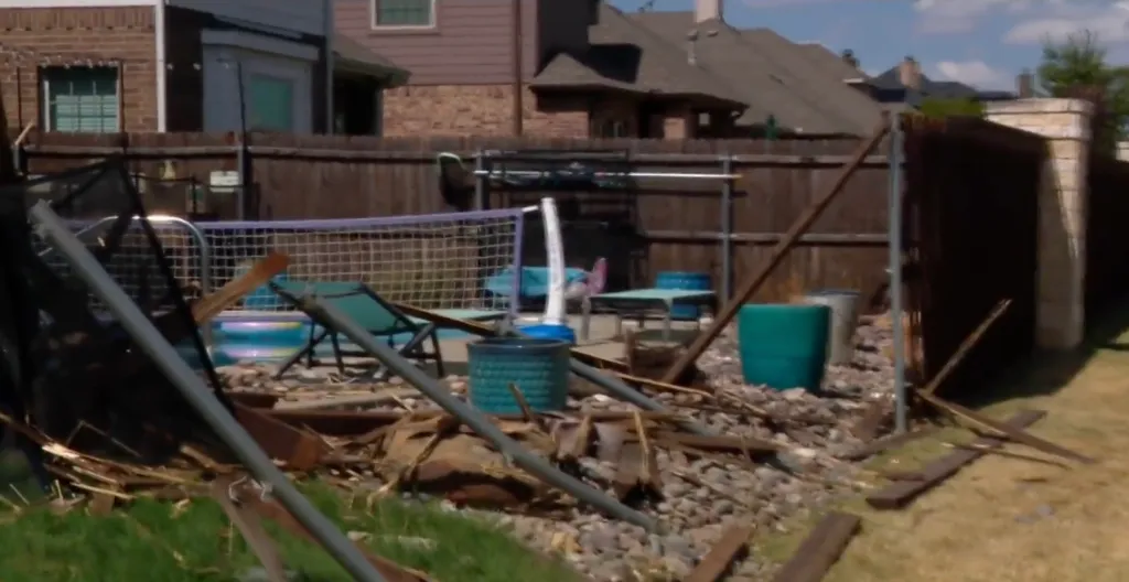 Damage to a Fort Worth fence after a car crash.