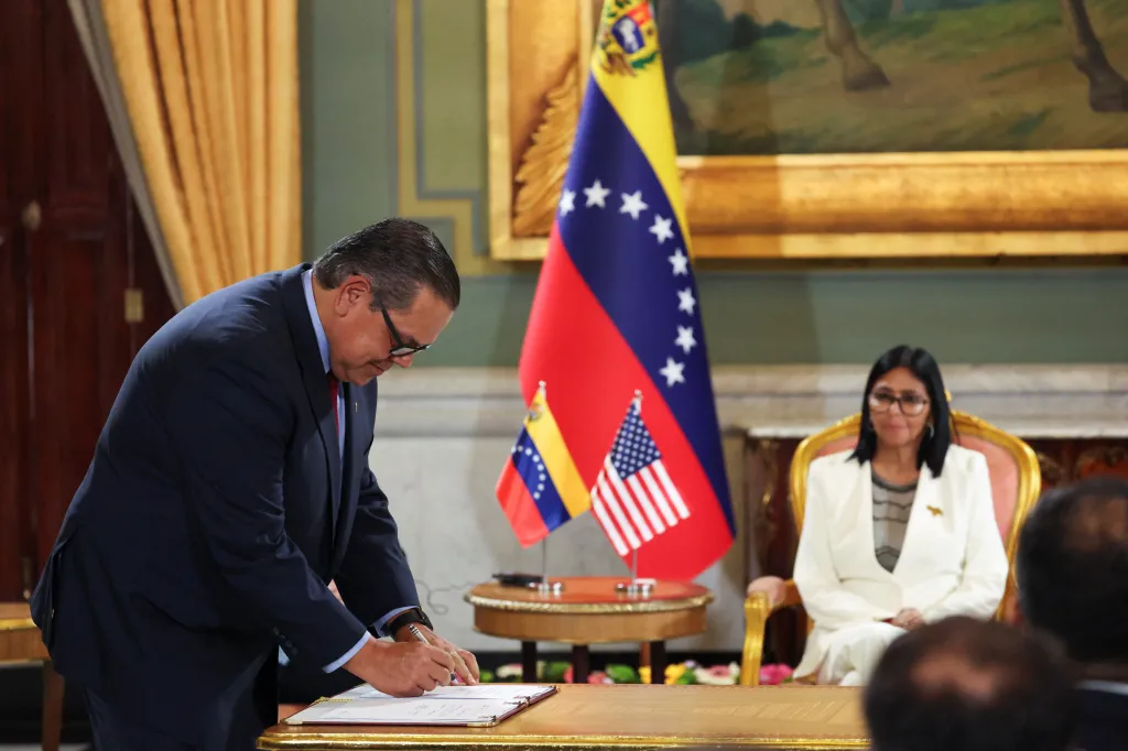 Chevron Venezuela President Mariano Vela signs an agreement to expand the company's operations.