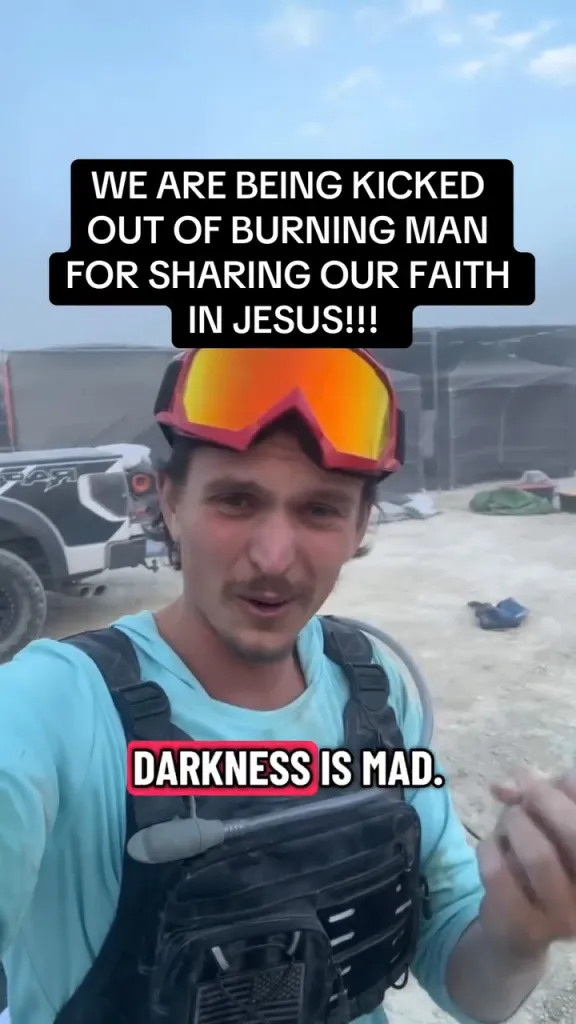 A man in ski goggles and a hydration pack says he is being kicked out of Burning Man for sharing his faith.
