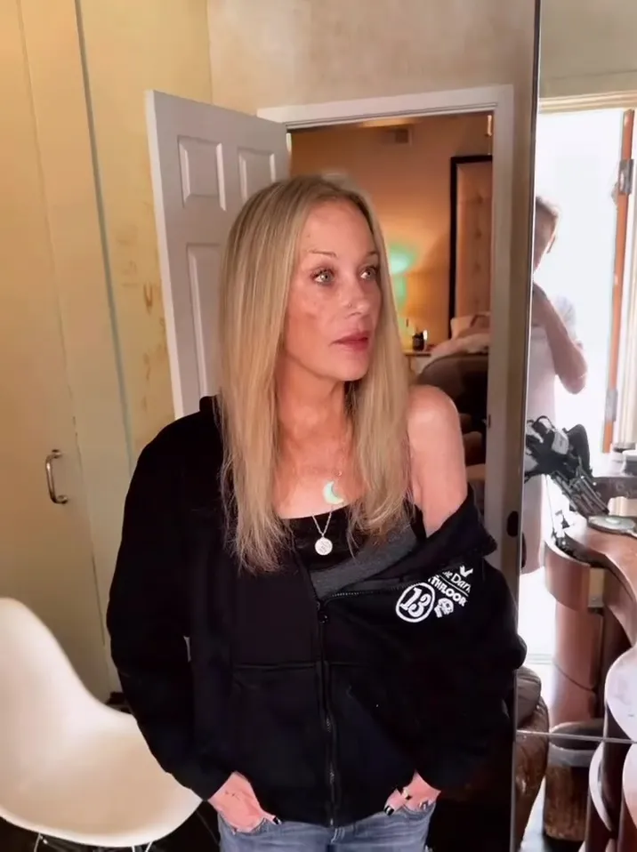Christina Applegate with newly colored hair and a spot on her cheek.