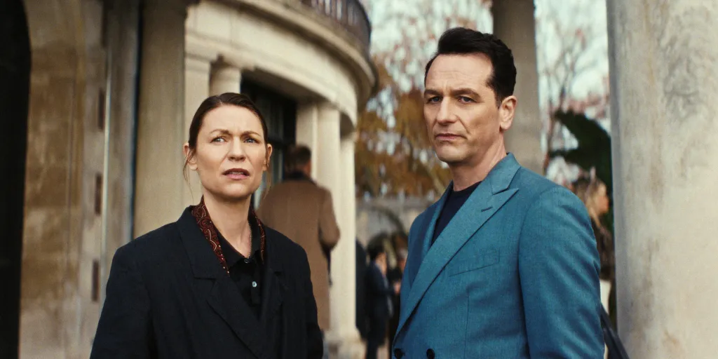 Claire Danes, in a black coat, and Matthew Rhys, in a blue blazer.