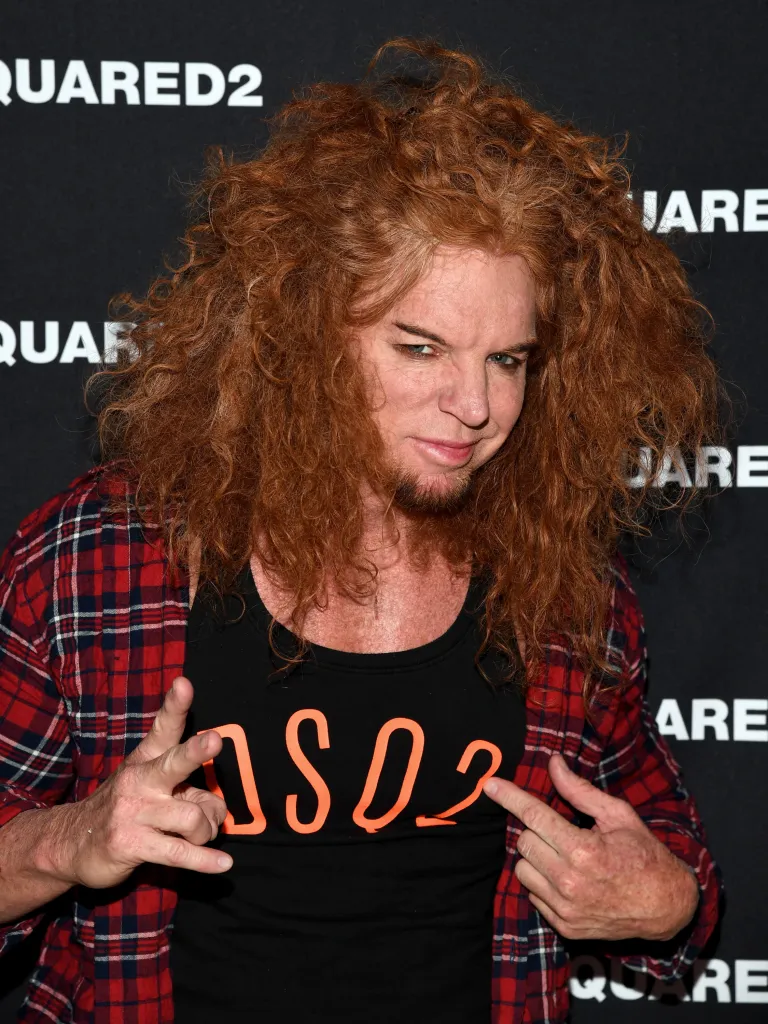 Comedian Carrot Top poses for a photo at the Dsquared2 grand opening party.