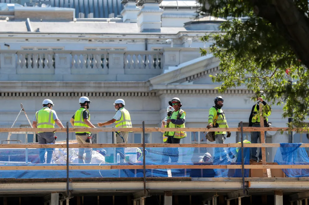 Construction workers on the site of the planned White House ballroom.