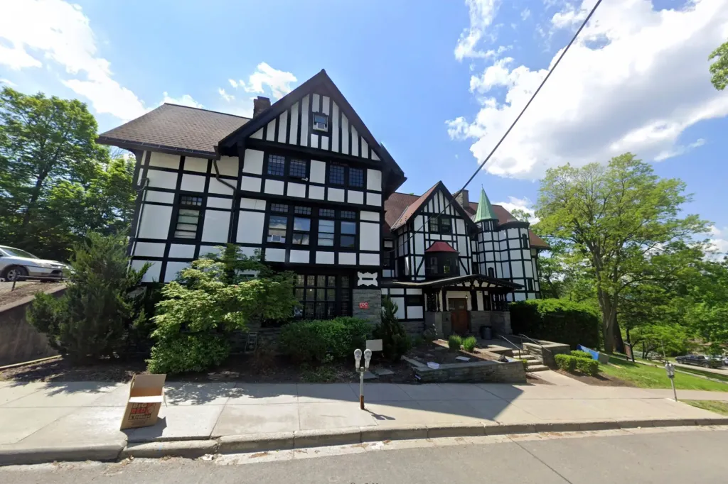 Photograph of the Cornell University Chi Phi fraternity house.