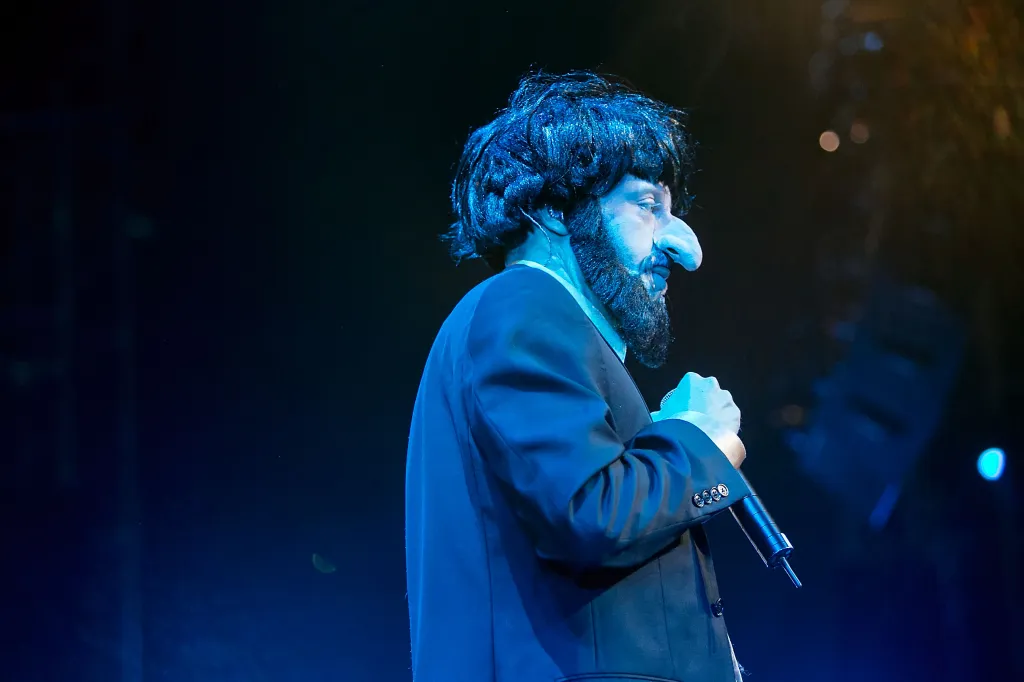 Maher brought up a costume Macklemore wore onstage in 2014 that consisted of a dark wig, beard and fake nose.