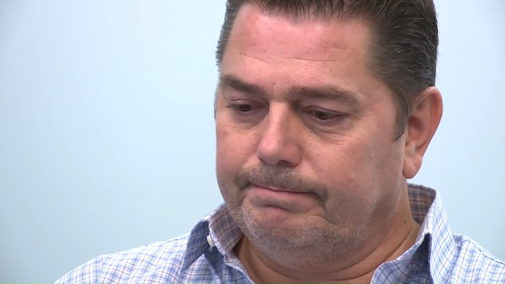 Joshua Strong, a middle-aged man, with a somber expression.