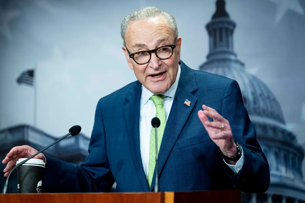 Senate Minority Leader Chuck Schumer speaking at a press conference about the fossil fuel industry's control over the Trump administration.