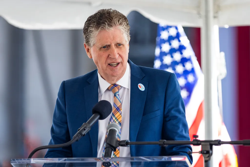 Dan McKee, governor of Rhode Island, speaking at a news conference.