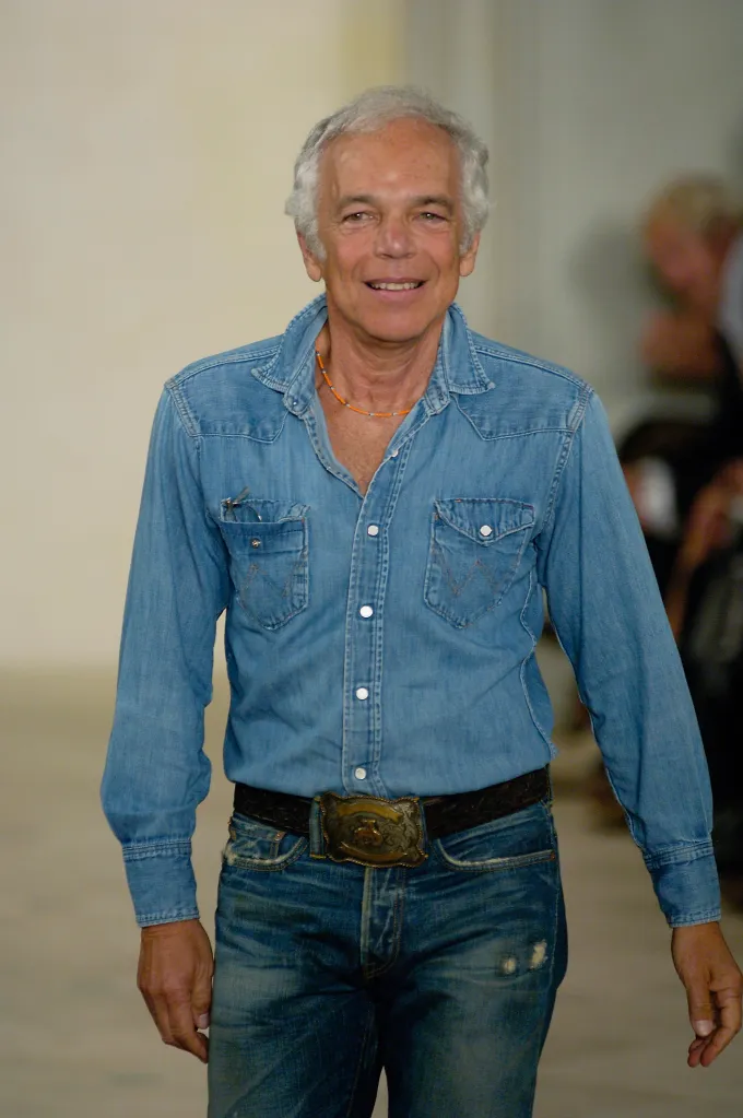 Ralph Lauren walking the runway in a denim shirt and jeans.
