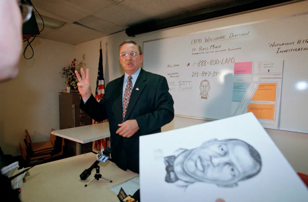 Lieutenant Ross Moen discusses the Notorious B.I.G. investigation next to a composite sketch of the suspect.