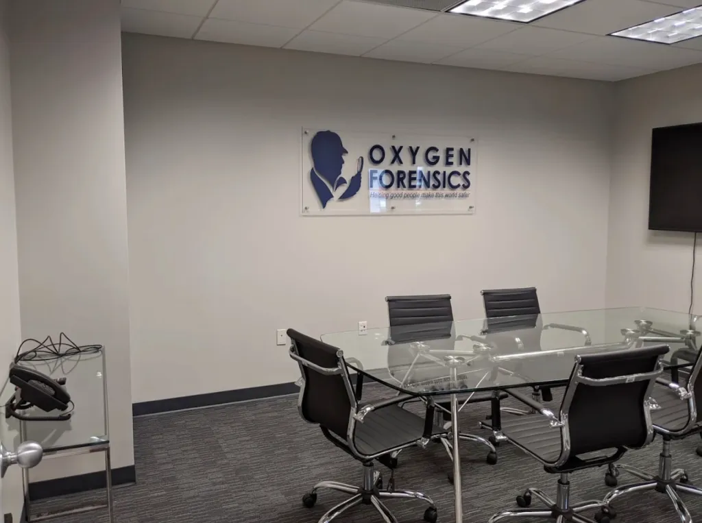 Oxygen Forensics software company sign in a conference room.