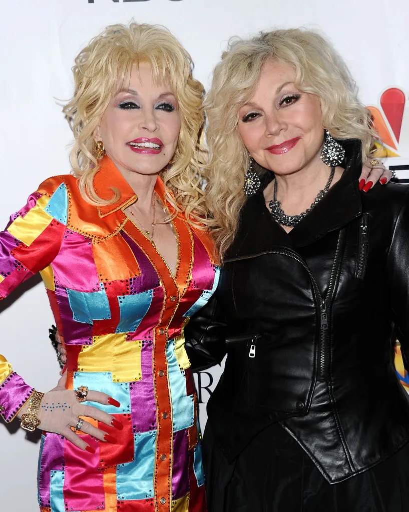 Dolly Parton in a multicolored patchwork coat and Stella Parton in a black leather jacket.