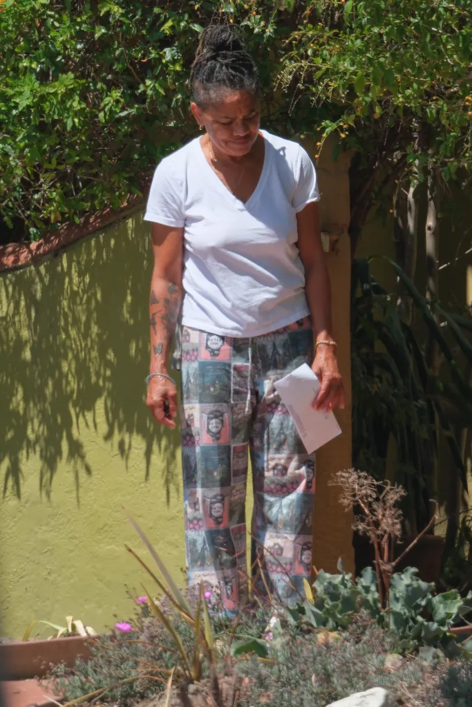Doria Ragland tends to her garden and collects mail.