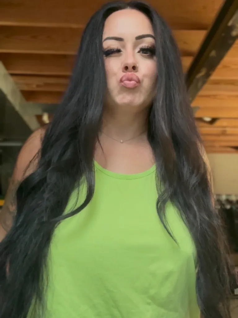 Megan Gaither puckers her lips and winks at the camera.