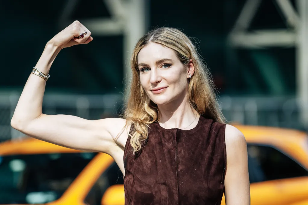Dr. Amanda Kahn flexing her bicep in Midtown, Manhattan.