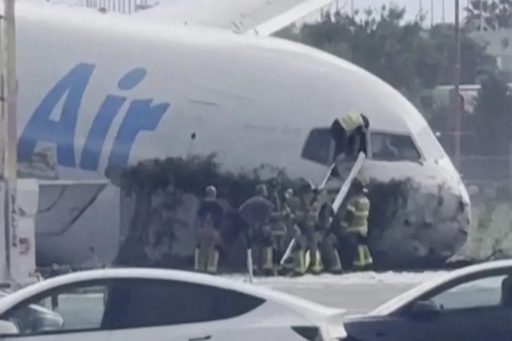 Rescue crews climbing into an Amazon cargo plane that overshot a runway in Miami.