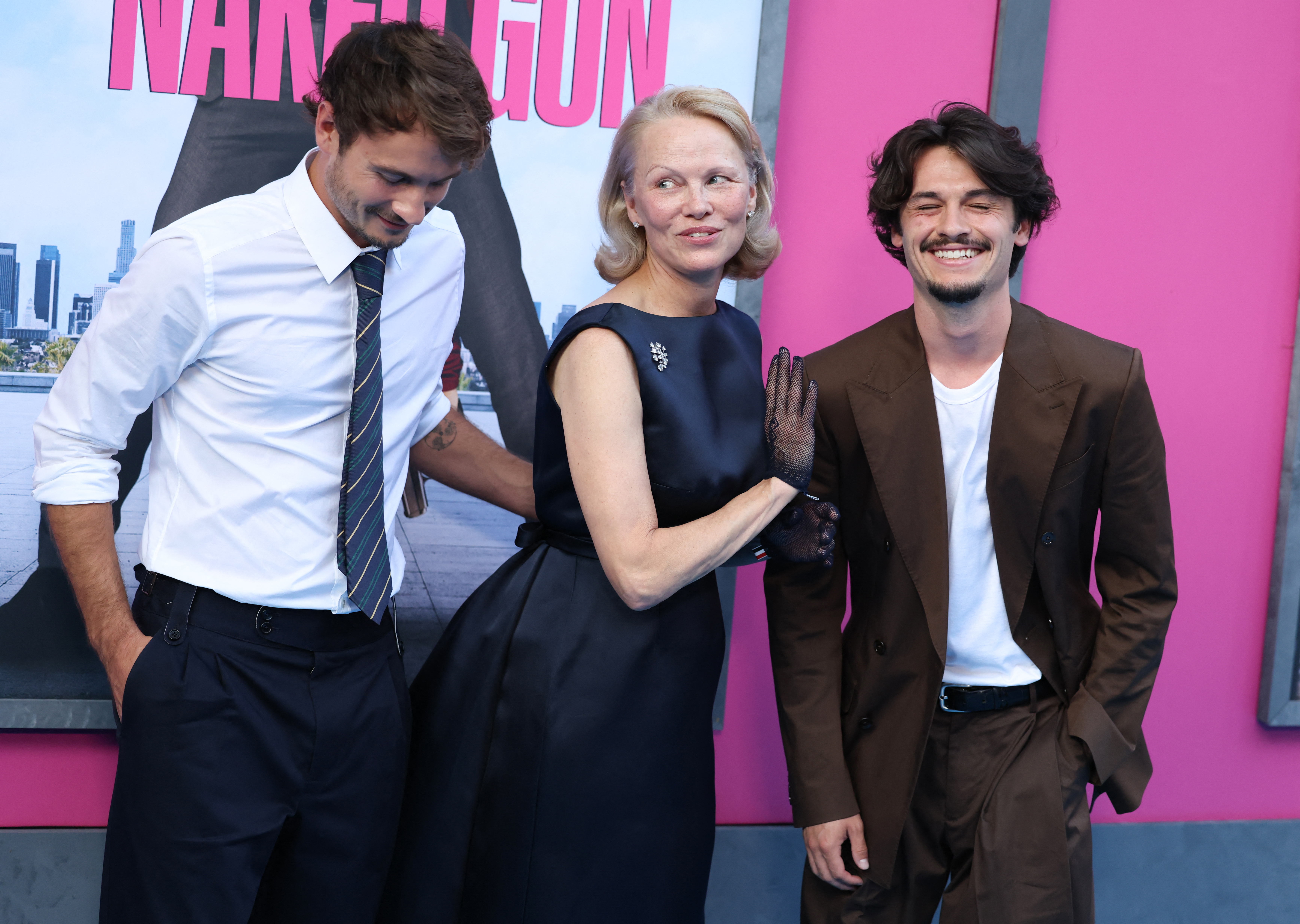 Canadian-US actress Pamela Anderson and her sons Brandon Thomas Lee (L) and Dylan Jagger Lee (R).