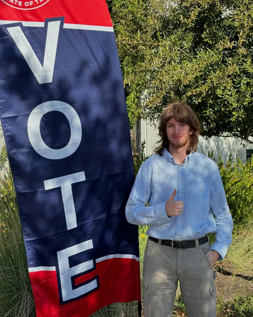 Dylan Sky MacAdams giving a thumbs up next to a 