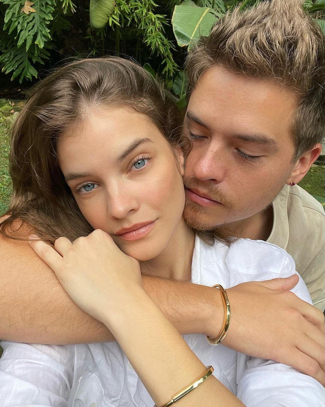 Barbara Palvin and Dylan Sprouse embracing each other.