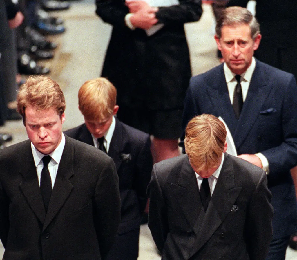 Earl Spencer, Diana's brother, her two sons Harry and William, and her former husband Charles, walking in Westminster Abbey.