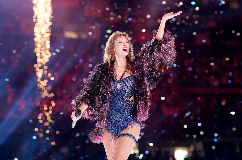 Taylor Swift performing onstage during The Eras Tour.