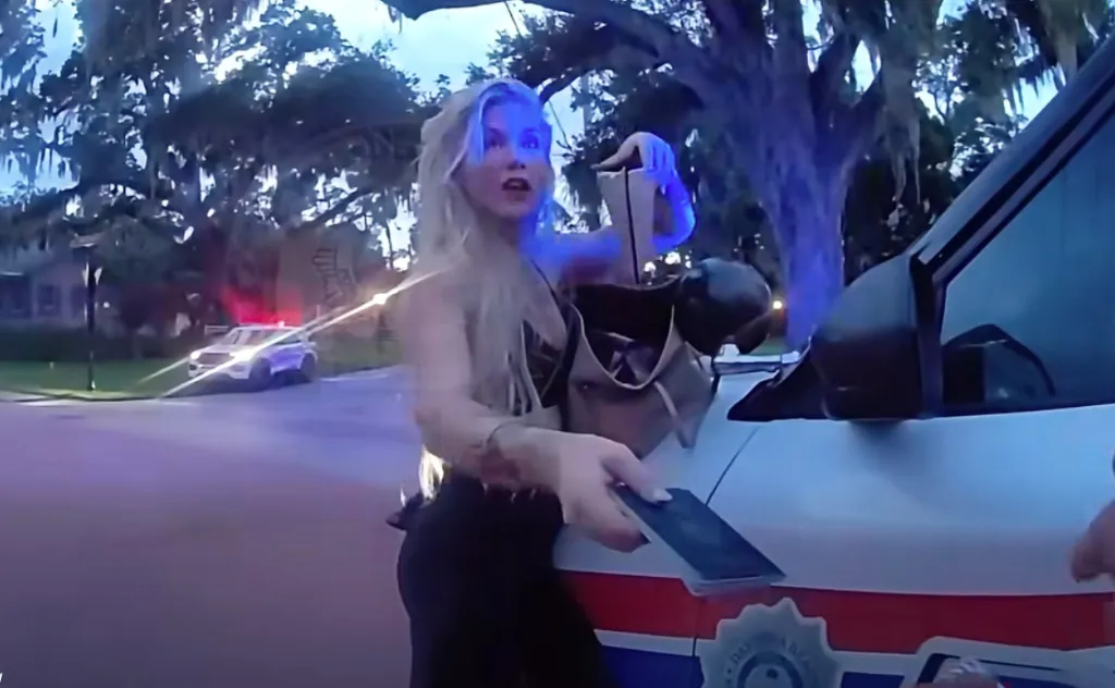 Elizabeth Boucher hands a police officer her passport instead of her driver's license following her alleged DUI crash.