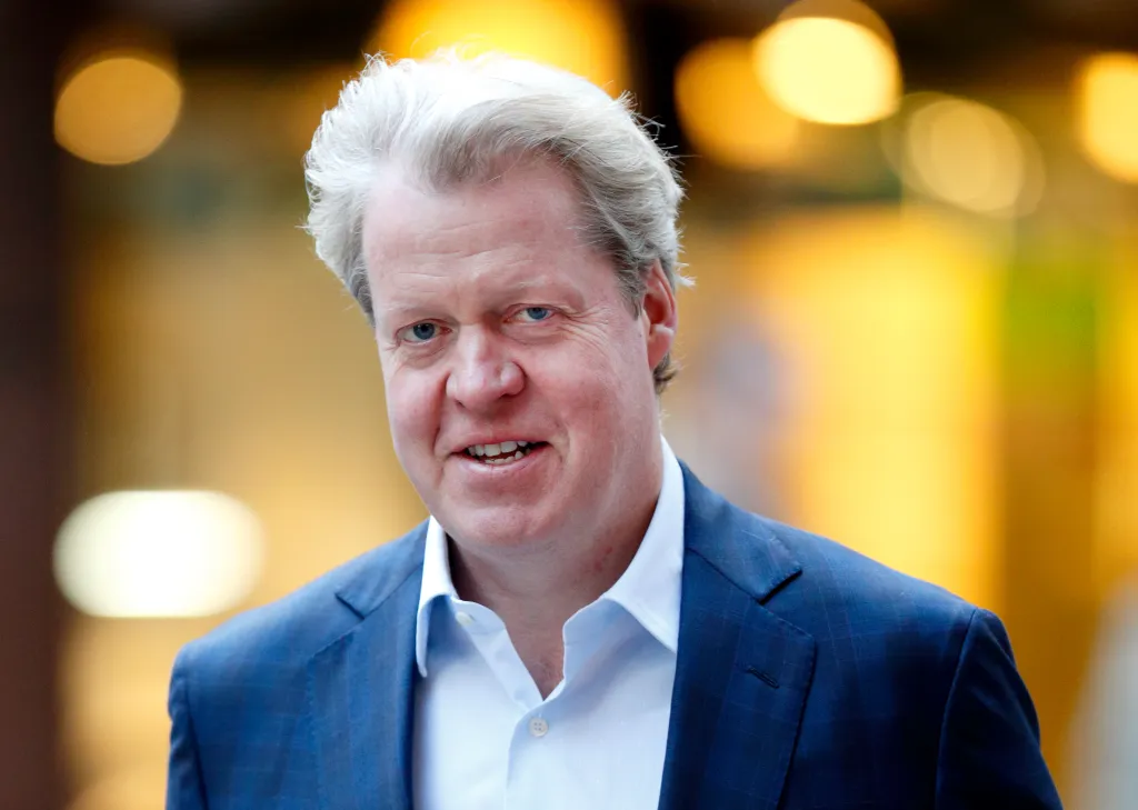 Earl Charles Spencer , in a blue blazer and blue shirt, attends the ICAP charity day.