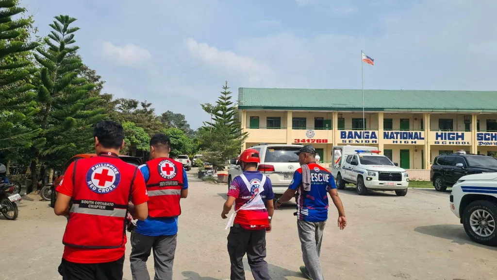 Emergency personnel walk at the site of a deadly shooting at a school in Banga, South Cotabato, Philippines, on September 18, 2026.