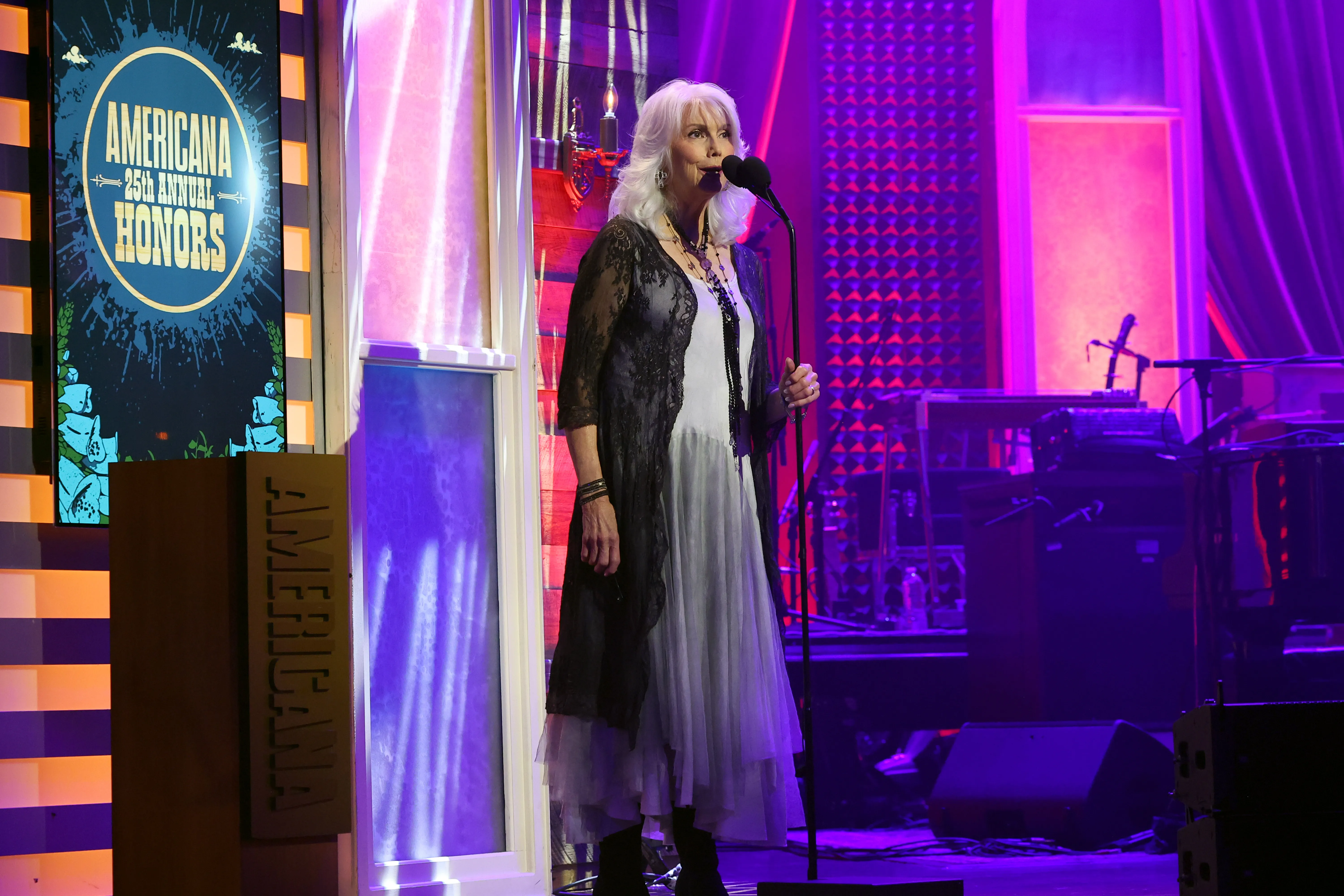 Emmylou Harris speaking on stage at the 25th Annual Americana Honors & Awards.