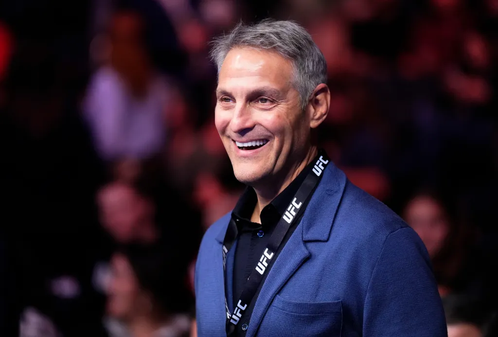 Endeavor CEO Ari Emanuel smiling in a blue suit at UFC 281.