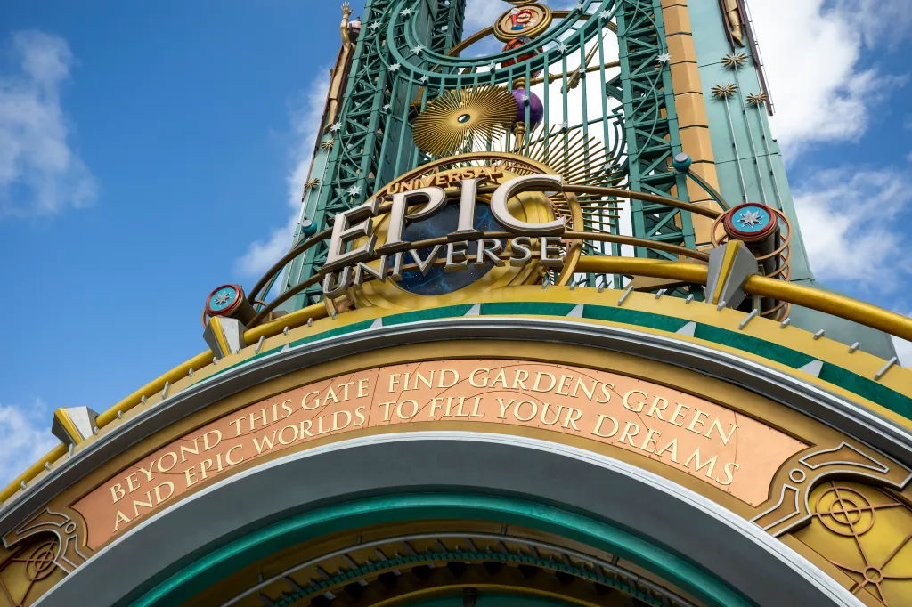 The entrance portal of Universal Epic Universe, featuring the words 