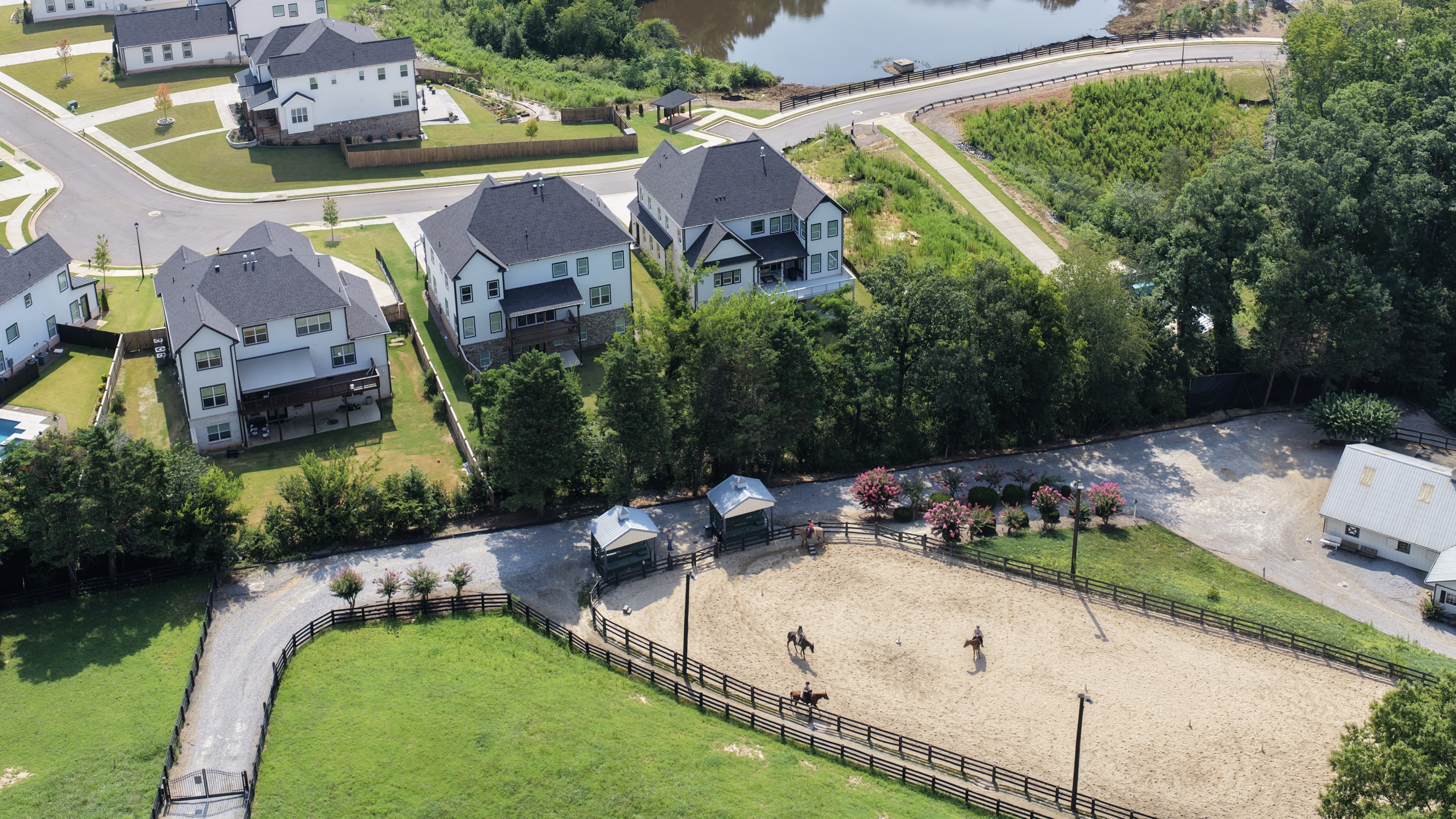 Aerial view of a residential property and neighboring horse farm in Alpharetta, Georgia.
