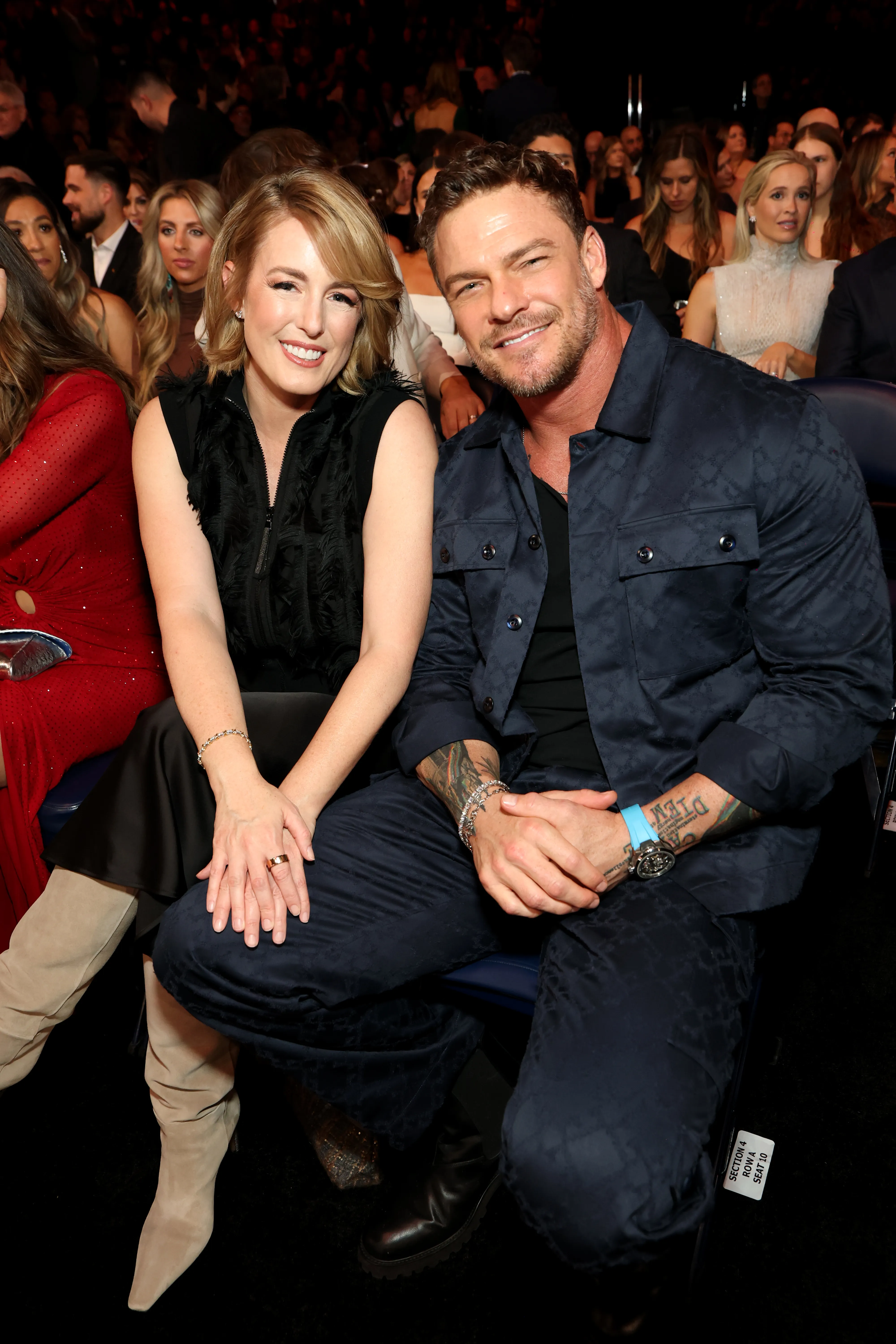 Catherine Ritchson and Alan Ritchson attend the 59th Annual Country Music Association Awards.