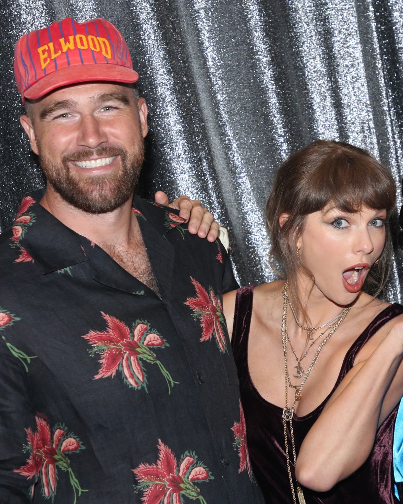 Travis Kelce and Taylor Swift posing backstage at 