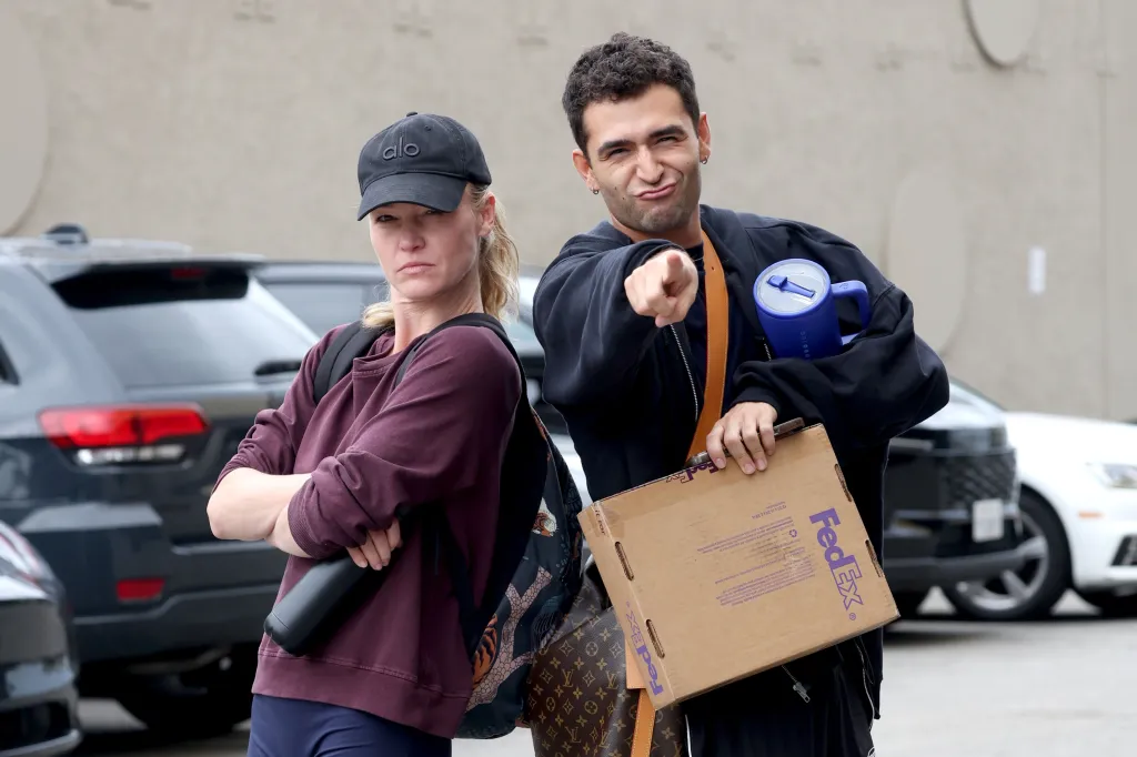 Julia Stiles and Ezra Sosa pose outside the 