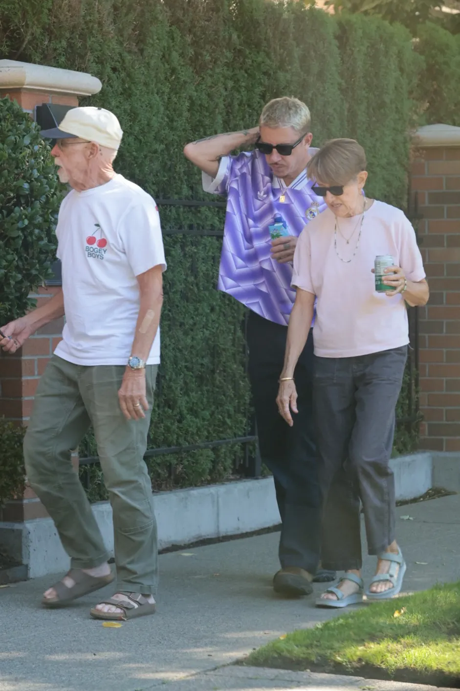 Macklemore walking with his parents near his Seattle home.