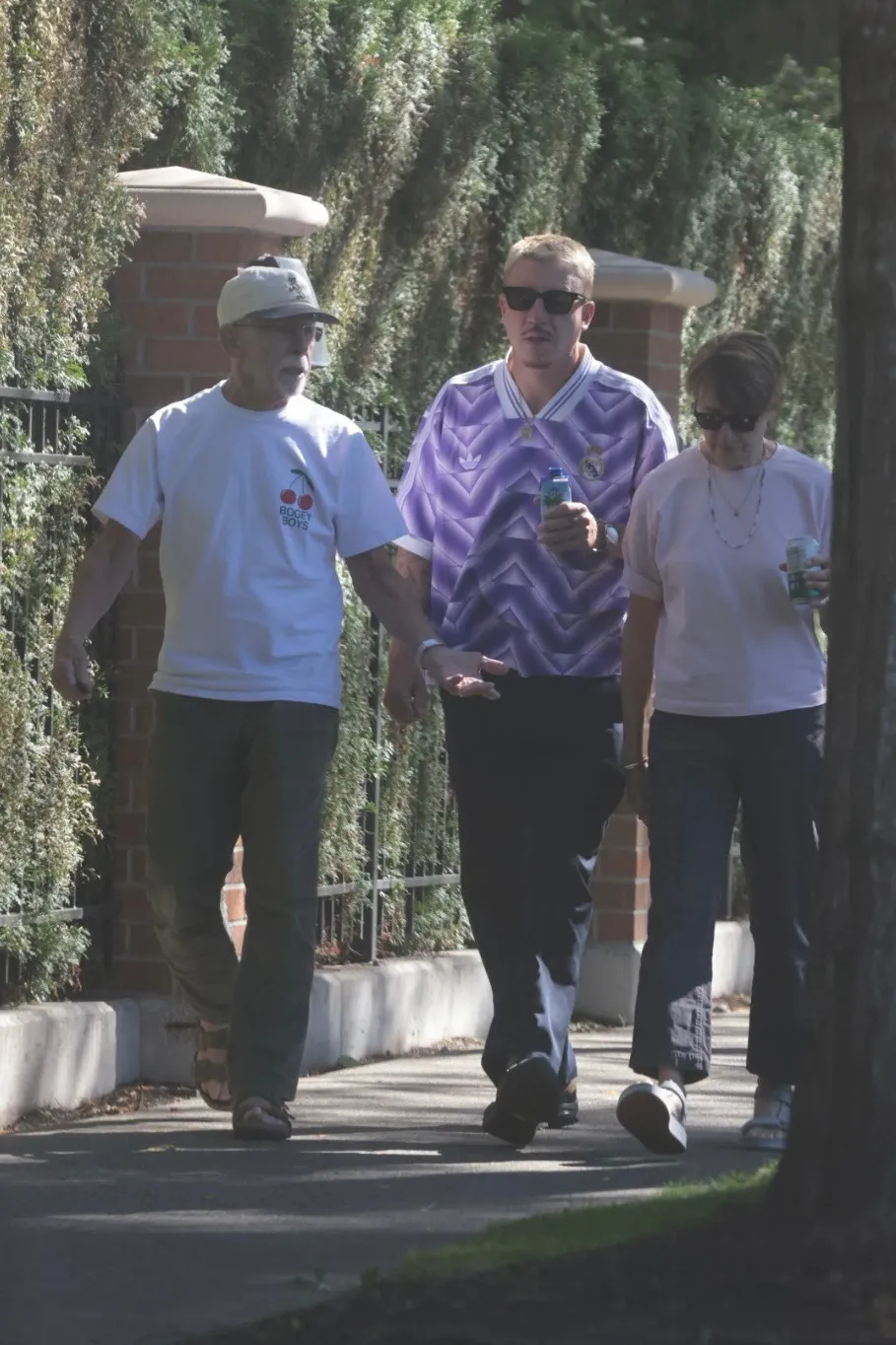Macklemore walks with his parents near his Seattle home.